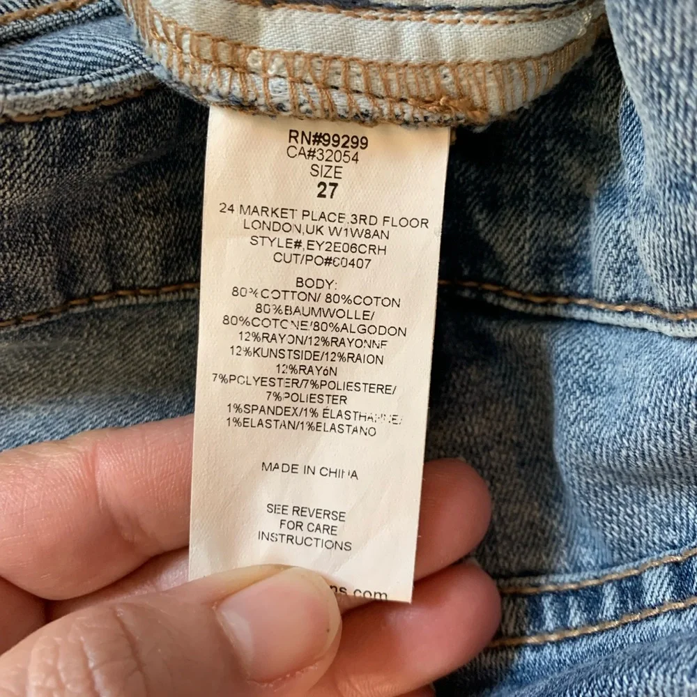 Level 99 jeans. Gold/silver design on bottom. Mid rise. Size 27.